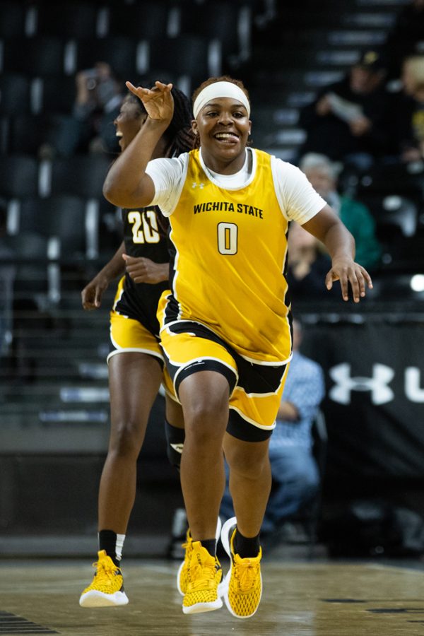 Senior Aniya Bell makes her way down the court after the Black Team missed a jumpshot on Oct. 27 during Shocker Madness.