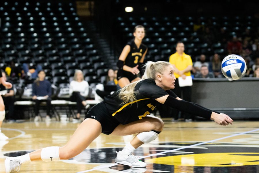 Freshman Katie Galligan dives for a ball against SMU on Oct. 9 in Koch Arena. Galligan completed two defensive sets for the Shockers.