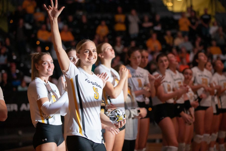 Junior setter Kaycie Litzau waves to the crowd inside Koch Arena on Oct. 28 before the game against South Florida.