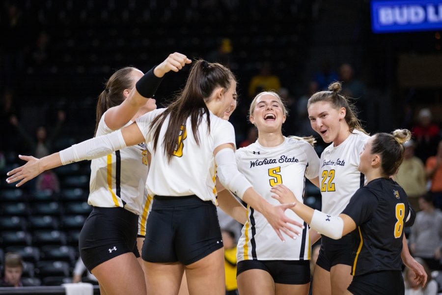 After securing a point over South Florida, the Shockers volleyball team celebrate together on Oct. 28 in Charles Koch Arena.