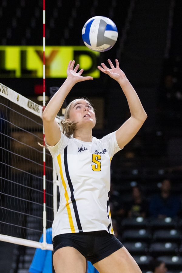 Junior Kaycie Litzau sets the ball during the game against the South Florida Bulls on Oct. 28. The Shockers won, 3-0.