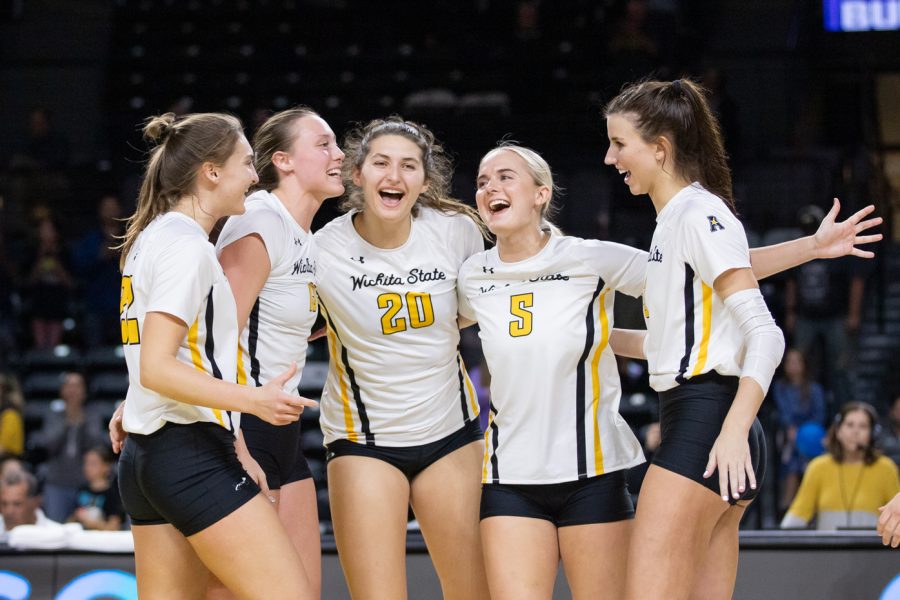 The Wichita State volleyball team celebrates after defeating South Florida, 3-0, on Oct. 28 inside Koch Arena.