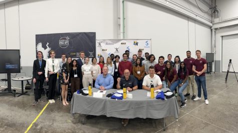 Competitors, judges, and mentors pose for a photo at the conclusion of the SpaceApps Challenge. Over the span of two days, competitors rushed to solve a series of problems with prizes on the line.
