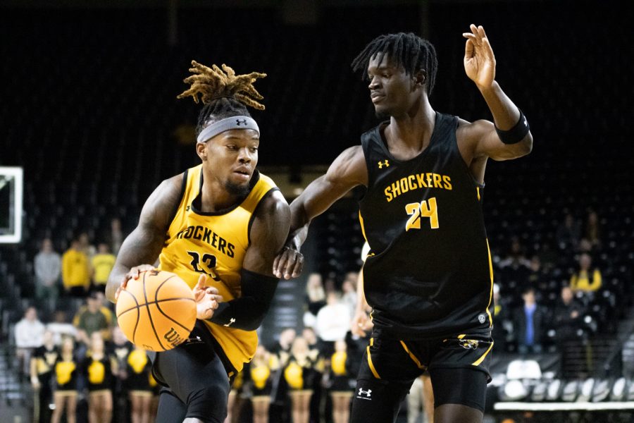 Teammates Gus Okafor and Isaac Abide go against each other in a scrimmage during Shocker Madness on Oct. 27 at Charles Koch Arena.