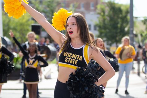 Cheerleader Olivia Lockwood performs during the Wagonmasters Downtown Chili Cookoff.