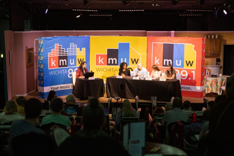 Sarah Jane Crespo, director of community engagement at KMUW, speaks to a group of panelists about the upcoming midterm election in Kansas.