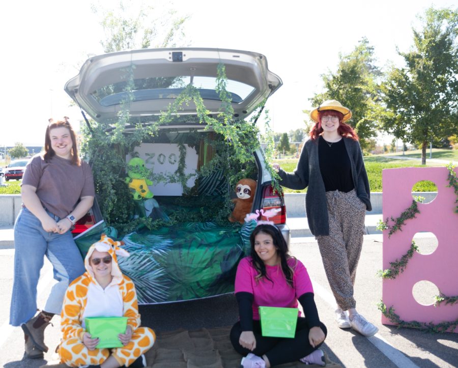 Members of the Gamma Pi Delta sorority decorated a car and themselves in a zoo theme and set up a game for kids to play alongside getting candy.