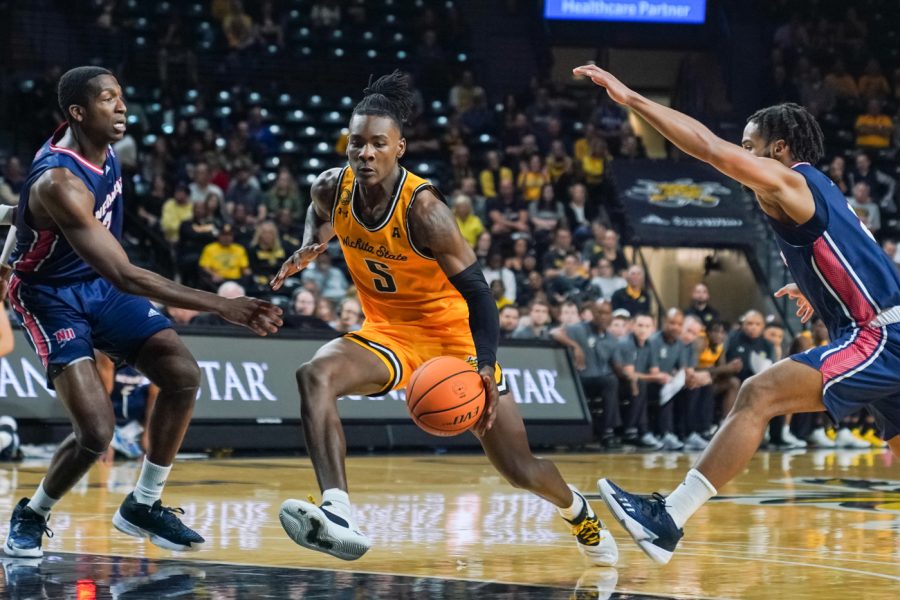 Sophomore gaurd Jaron Pierre Jr. drives down inside Charles Koch Arena on Nov. 2. Pierre had five points, two assists and two steals in a 83-52 win against Newman in an exhibiton game.