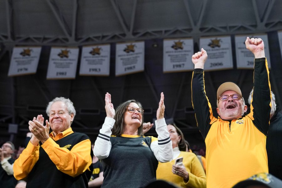 Shocker fans celebrate from the crowd at the mens basketball game against Mizzou at Charles Koch Arena on Nov. 29. 