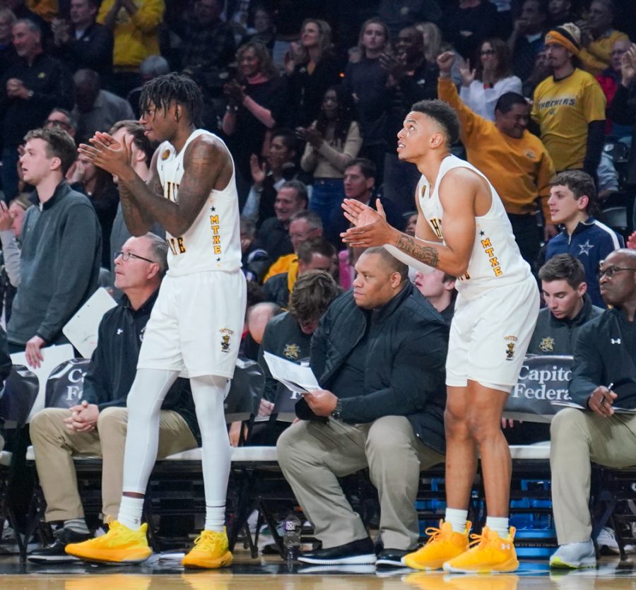 Junior guard Jaykwon Walton and sophomore gaurd Xavier Bell watch the game from the bench while encouraging their teammates. The mens basketball team lost to Mizzou 88-84 on Nov. 29. Walton scored 14 points and had 10 rebounds. Bell scored 12 points. 