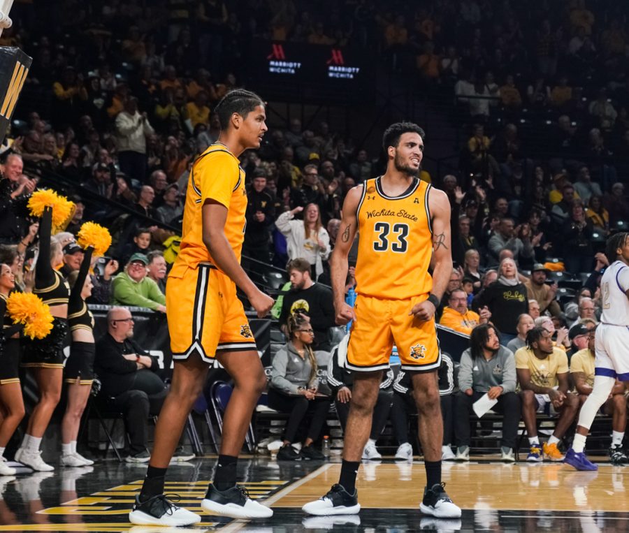 Sophomore+Kenny+Pohto+and+senior+James+Rojas+celebrates+after+a+basket+scored+against+Alcorn+State+at+Charles+Koch+Arena+on+Nov.+12.