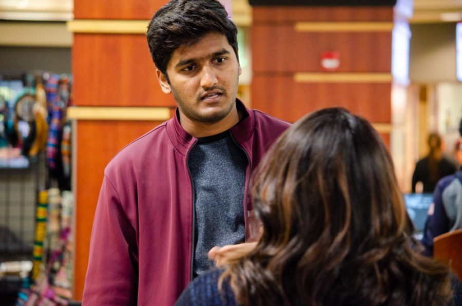 First generation student Akash Kurra talks with First Generation Student Organization Co-Advisor Lydia Santiago. On Nov 10, the First Generation Student Organization hosted a first-gen mingle for first-gen students to connect.