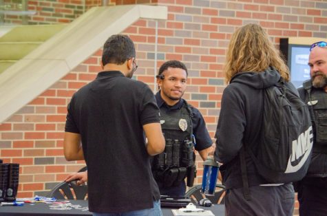 Officer Thomas of the Wichita Police Department engages in conversation with students. On Oct. 31, the WSUPD hosted Coffee with a Cop to encourage students to interact with their local law enforcement.