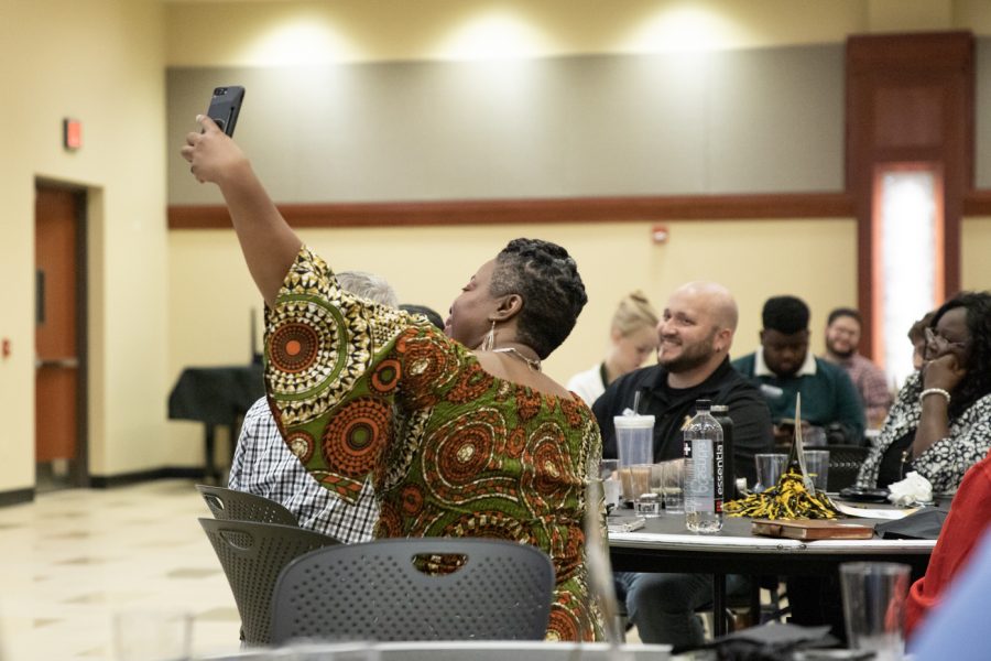 Regina Platt, a racial justice advocacy coordinator with YMCA in northeast Kansas, takes a selfie after her speech. On Nov. 4, she addressed racism and stereotypes in society to a crowd of WSU faculty, staff and students.