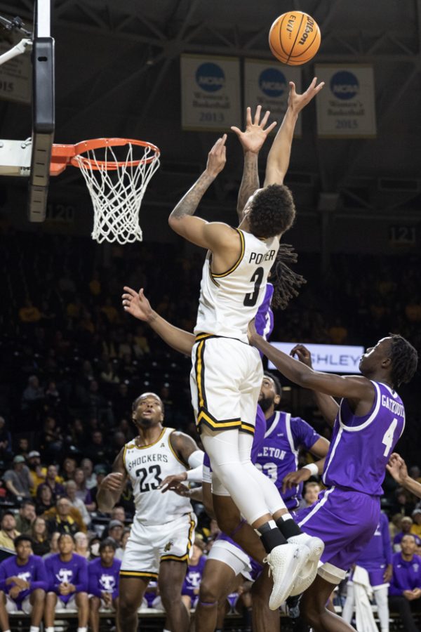 Senior guard Craig Porter Jr. goes up for a two pointer during the game against the Texans on Nov. 26. The Shockers won, 83-71.