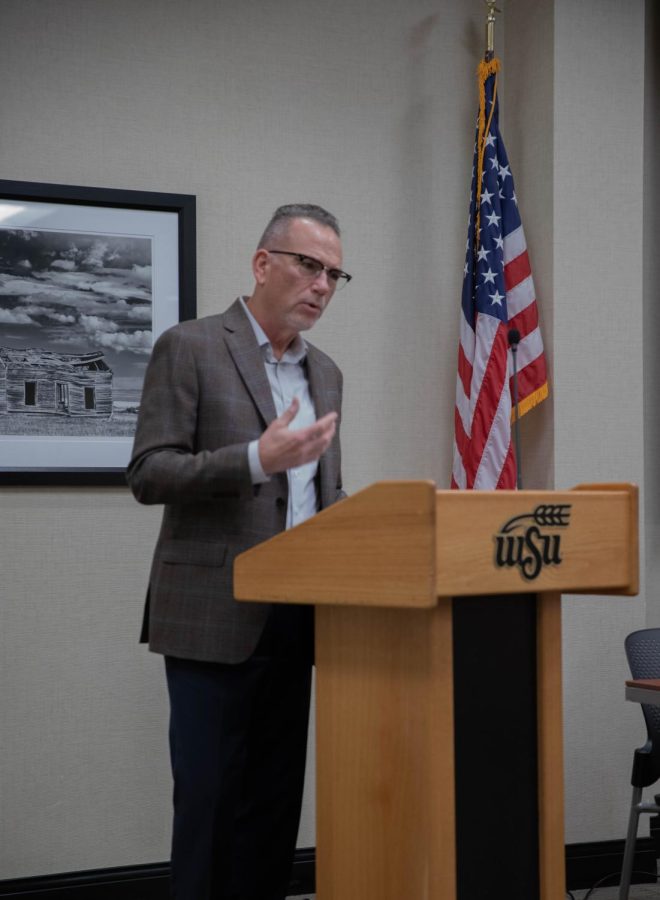 Michael Birzer, a criminal justice professor and graduate coordinator, introduces the panelists of the WSU safety discussion. The panel and following open forum was held on Nov. 9 and shared the perspectives of various important faculty figures regarding campus safety.