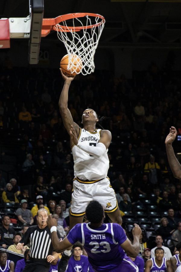 Sophomore guard Jaron Pierre Jr. goes up for a shot during the game against the Texans on Nov. 26. The Shockers won, 83-71.