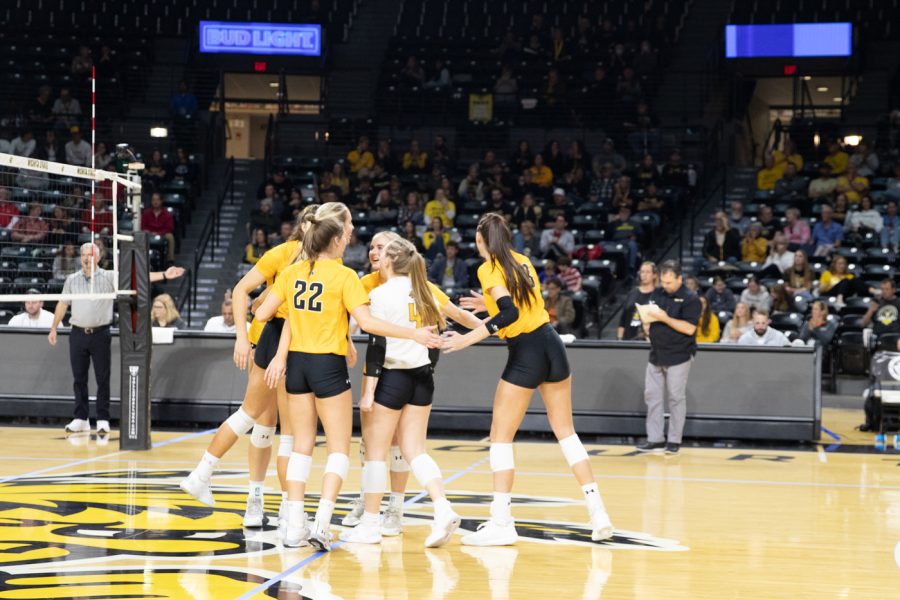 The+volleyball+team+celebrates+their+three+point+lead+after+losing+the+second+set+against+Cincinnati+on+Nov.+21.+