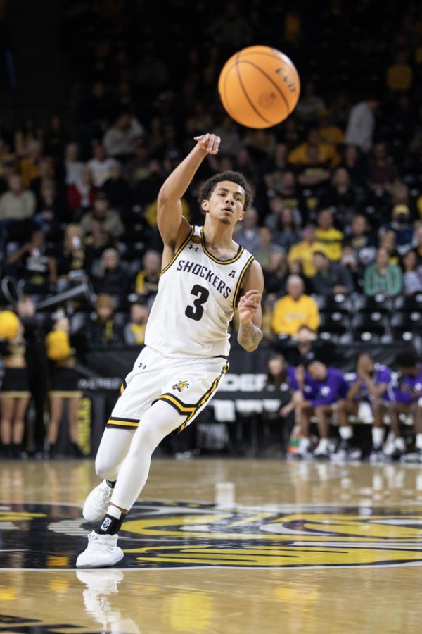 Senior guard Craig Porter Jr. passes the ball to other players on the court during the game against Tarleton State on Nov .26.