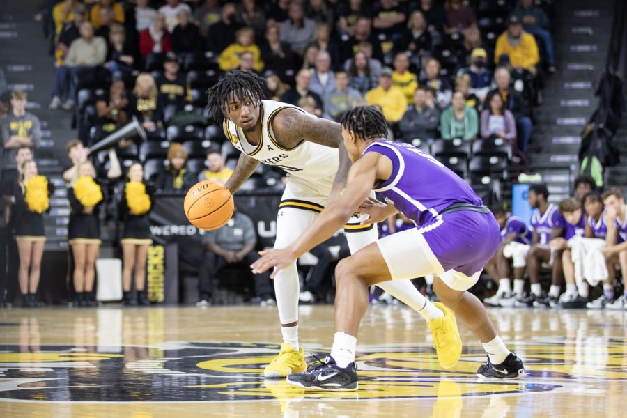 Junior guard Jaykon Walton dribbles the ball, looking for a player to pass to on Nov. 26. The Shockers played Tarleton State and won, 83-71.