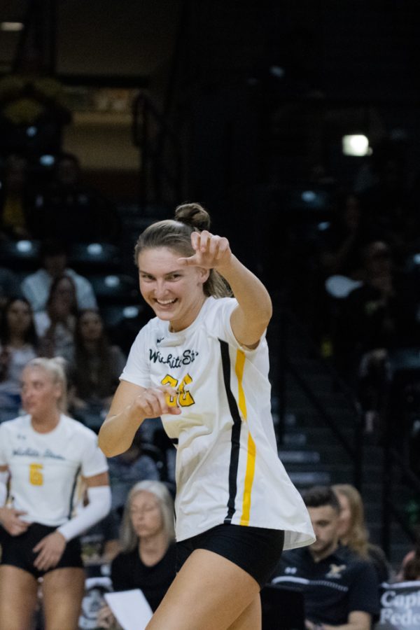Sophmore outside hitter Morgan Webber celebrates after a win against Temple on Sep. 23 at Charles Koch Arena. Webber had four kills against the Owls.