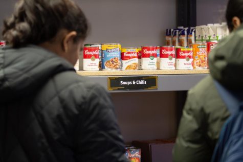 Students look through the Shocker Support Locker for different food or hygiene products. The locker offered free products to students, faculty and staff Monday through Friday.