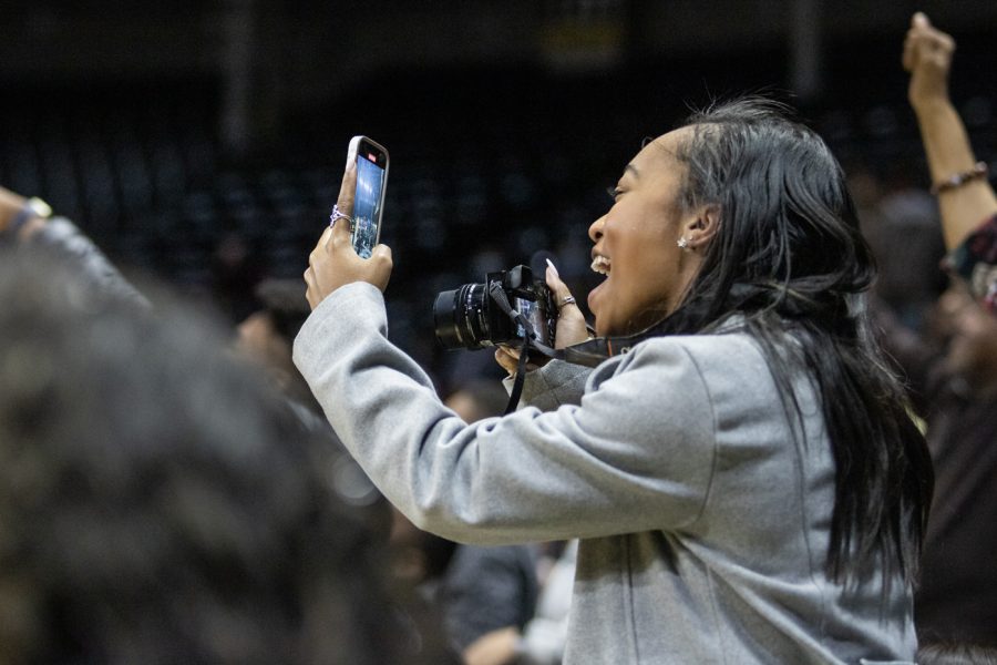 People in Charles Koch Arena cheer on the graduates inside Charles Koch Arena on Dec. 18.
