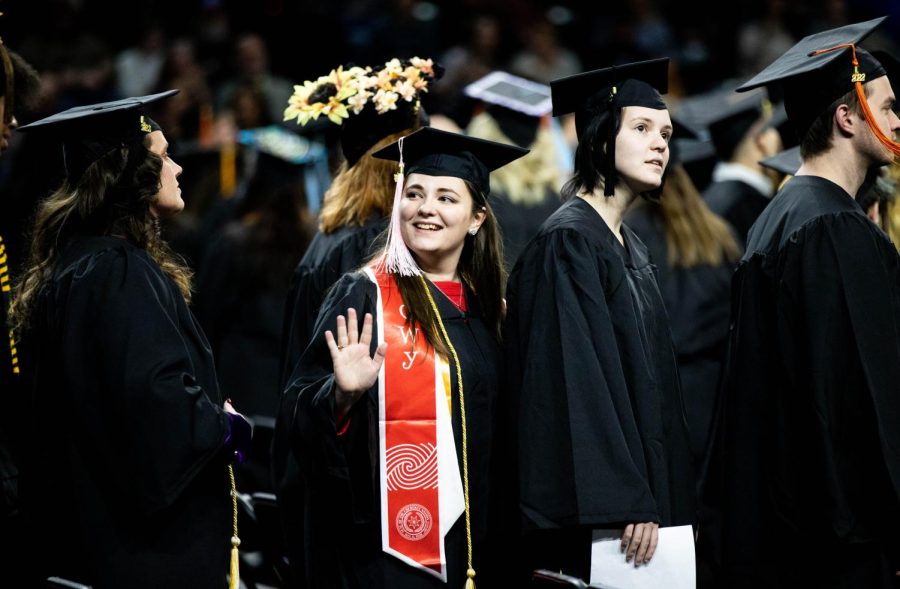 A graduate waves to loved ones during the Fall 2022 Commencement ceremony.