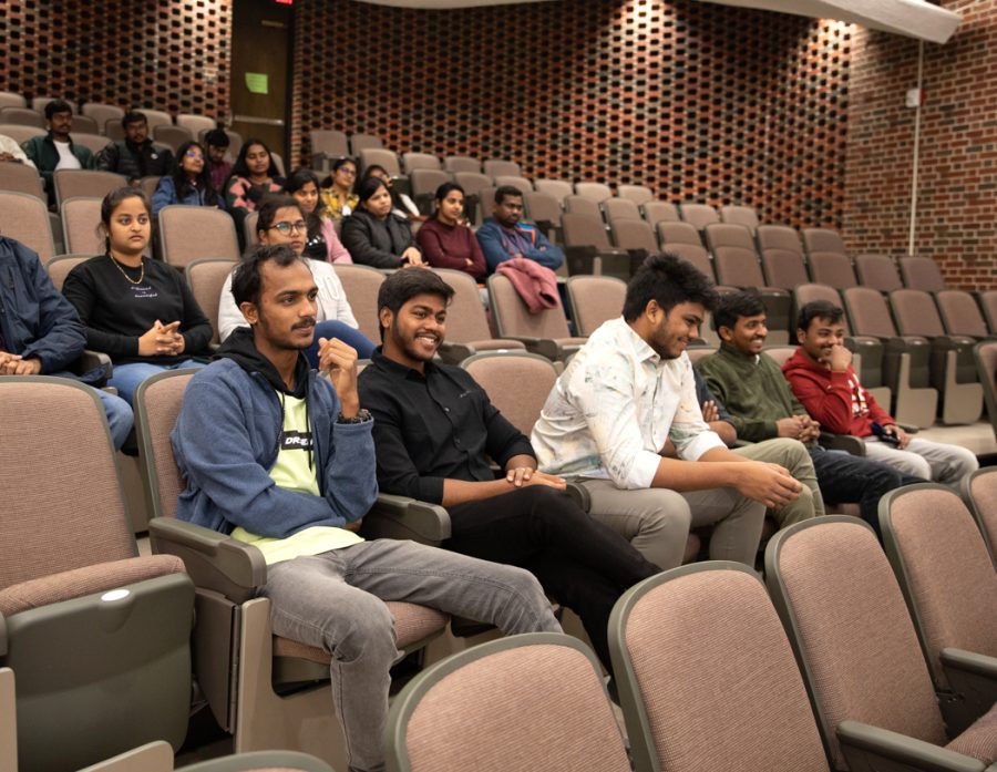 Two students listen to a presentation at the freshers party. The Indian Student Association hosted several guest speakers, including WSU police officers and professors.