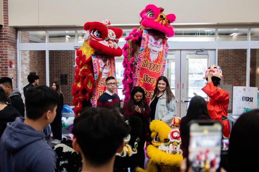 The Office of Diversity and Inclusion poses for a photo with the St. Anthony’s Lion Dance Team.
