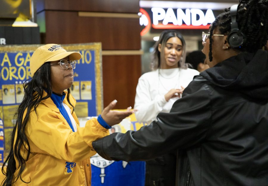 Melanie Gainey, alumna of chapter Gamma Chi, speaks to a student in the RSC about Sigma Gamma Rho Sorority Inc. on Jan. 24. Ananda Smith was the president of Sigma Gamma Rho Sorority Inc.