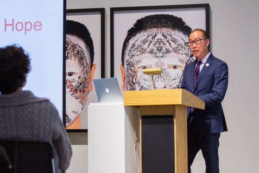 Chau Thuy stood at the podium to share his experience as a Boat Person in Vietnam. He explained his personal story as a refugee and how this influenced his passion for art.