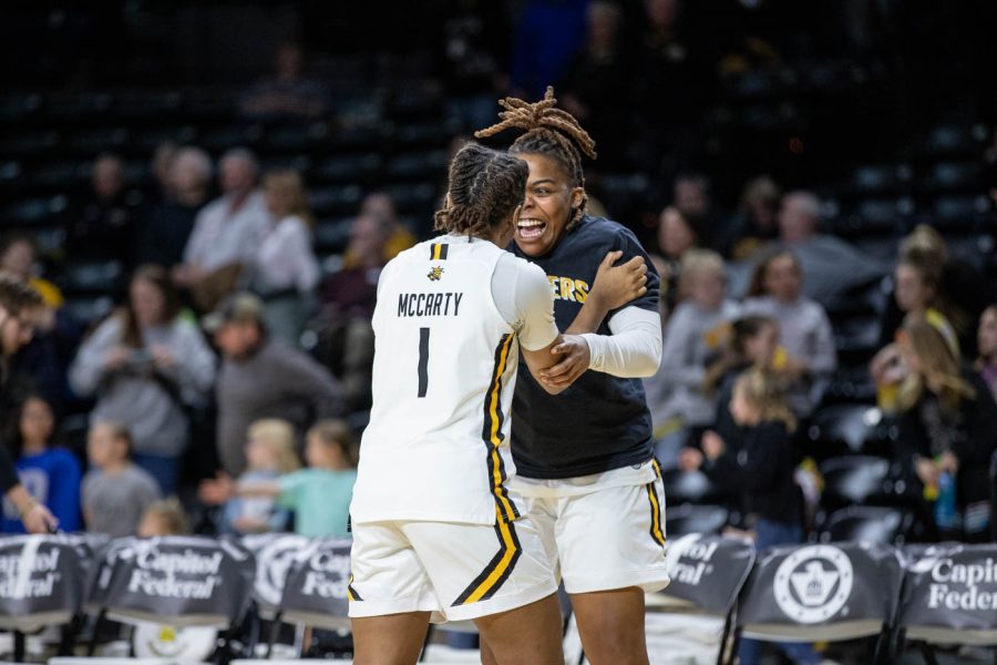 Players+DJ+McCarty+and+Aniya+Bell+celebrate+after+the+final+buzzer+at+Saturdays+game.+At+their+last+home+game%2C+Shockers+beat+Temple+79-67.