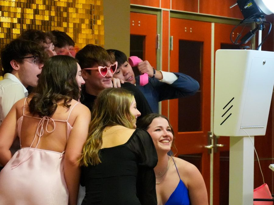 Students pose for a photo at the photobooth during the Fairmount Formal on Feb. 11. The Lamphouse Photo Booth provided free prints for atendees.