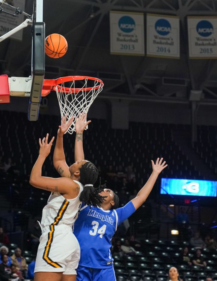 Senior forward Trajata Colbert goes up for a basket in the lane against Memphis. Colbert scored 11 points and grabbed 10 rebounds, making it her fifth double-double of the season.