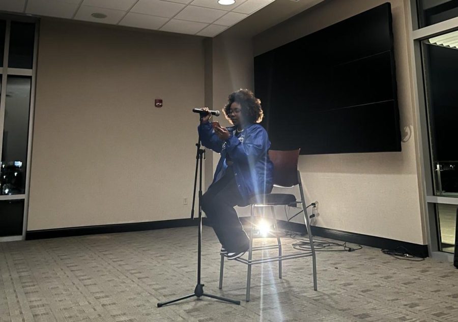 Latitia Murdock reading her poem titled ‘Poetic Lover’ at the “Love Jones Poetry Night” in the Rhatigan Student Center on Feb. 9. 