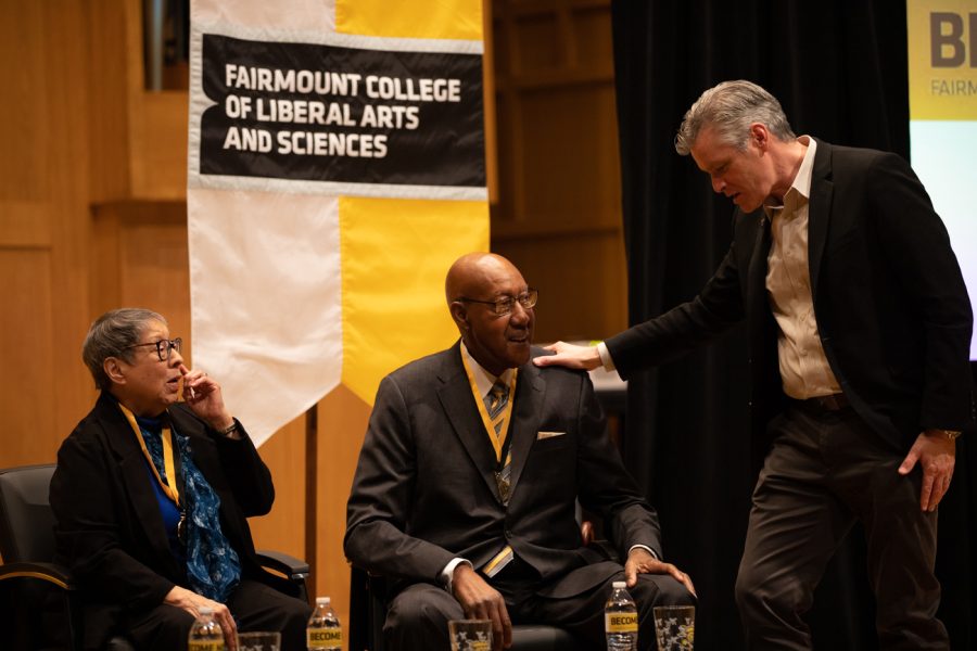 Richard Muma, Wichita State President, places his hand on Louis Sturns shoulder. Sturns was inducted into the Fairmount College Hall of Fame on Feb. 7.