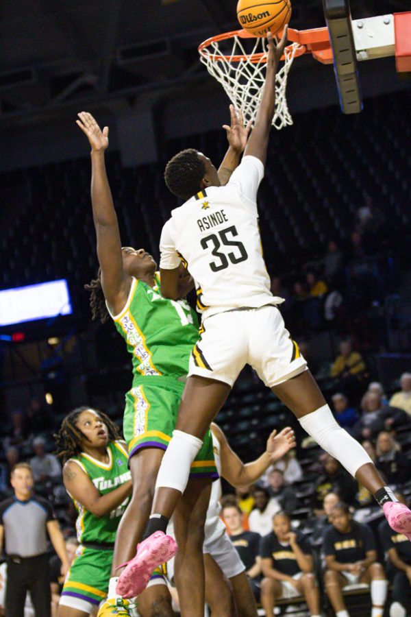 Senior forward Jane Asinde goes in to make a shot during the game against Tulane on Feb 9, at Charles Koch Arena. The Shockers won 69-61 with Asinde making 22 of those 69 points.