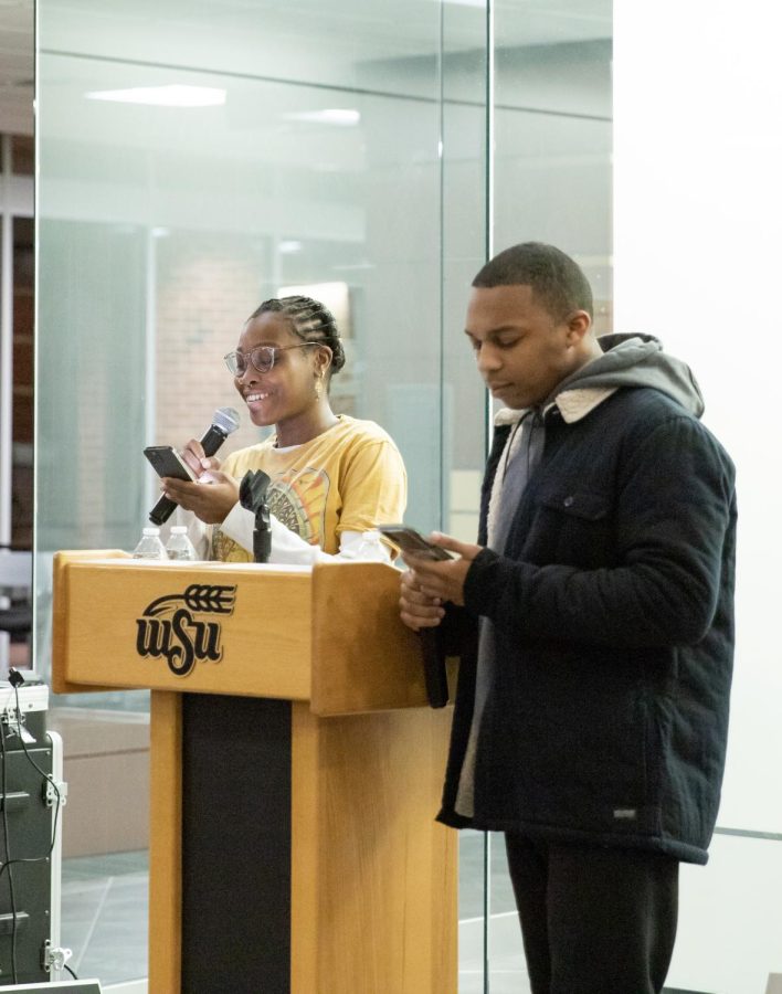 Maurissa Cunningham, a member of Black Student Union, sings the hymn Lift Every Voice and Sing with William Butler, a passage leader in ODI. The students sang at the 15th Annual MLK Commemoration on Jan. 31.