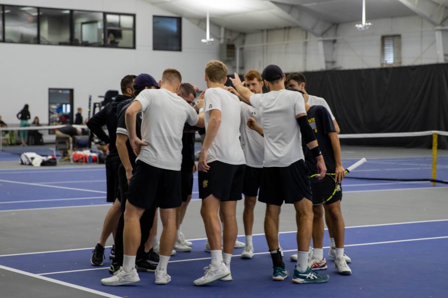 Wichita+State+mens+tennis+team+huddles+during+break.+With+Go+Shocks%21+the+team+is+off+to+their+singles.