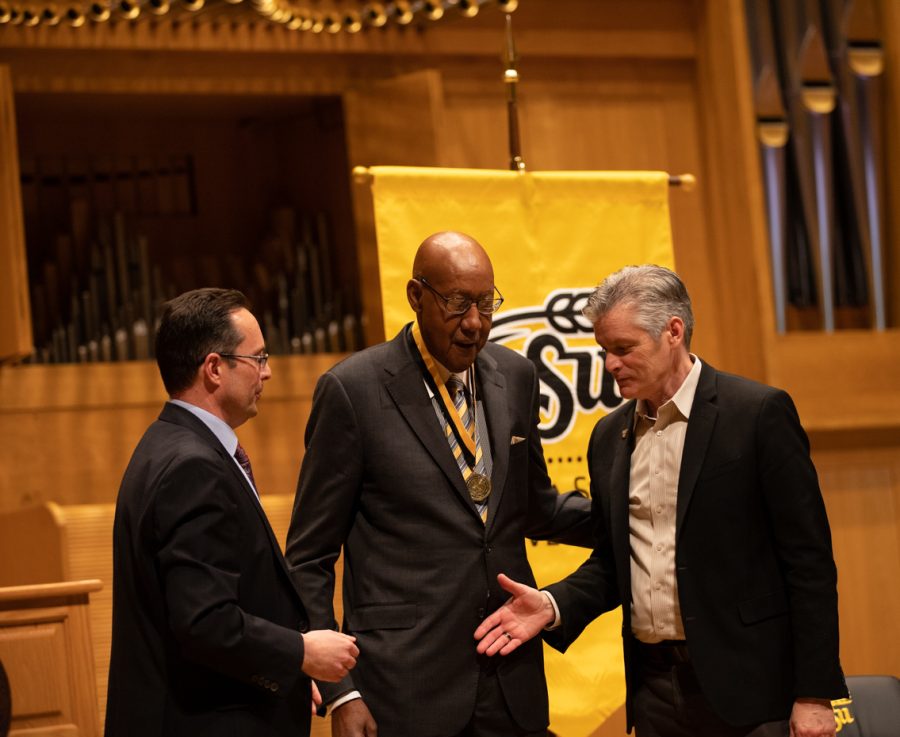 Andrew Hippisley, Dean of Fairmount College, and Richard Muma, Wichita State president, recognize Louis Sturns (center) onstage. Sturns was inducted into the Fairmount College Hall of Fame on Feb. 7.