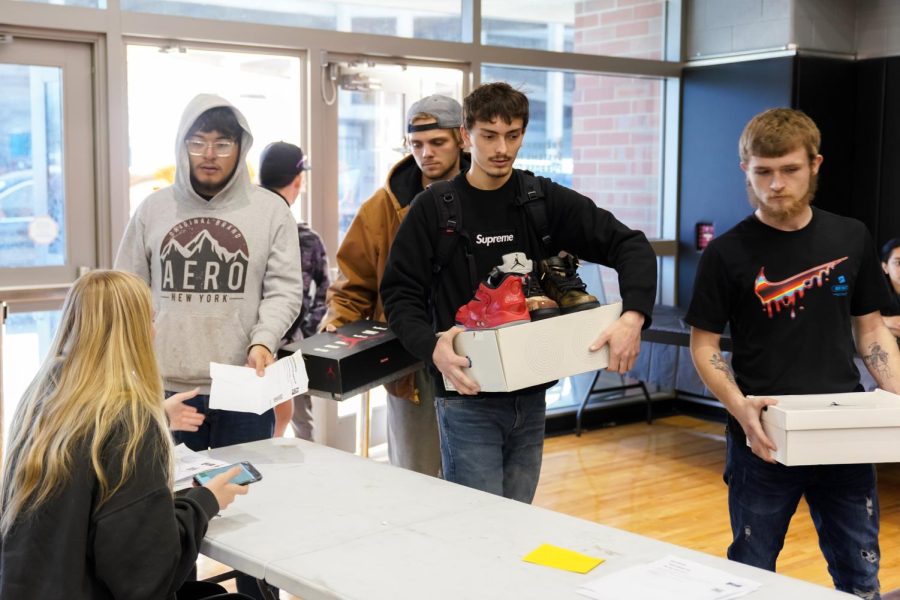People around Wichita bring in sneakers to trade and sell during the Kansas Sneaker Fest on March 25. The event was a convention for sneaker enthusiasts to trade, sell and buy in Charles Koch Arena.