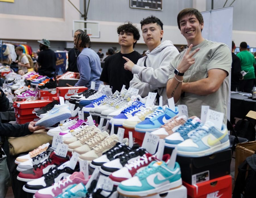 Sneaker vendors pose during the Kansas Sneaker Fest in Charles Koch Arena on March 25. 