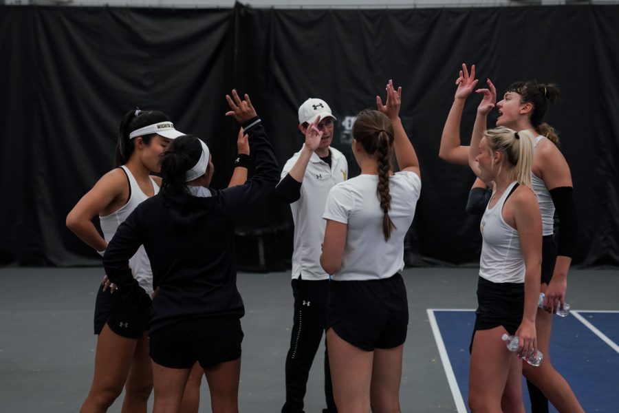 Wichita State womens’s tennis team huddles during break. With “Go Shocks!” during match against Omaha at Gensis Rock Road on Mar. 26.