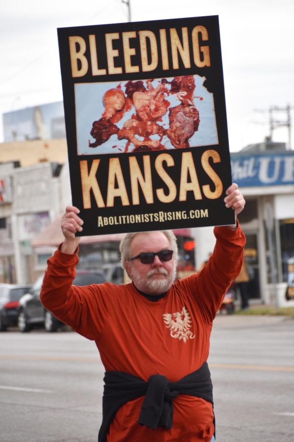 A Free the States member marches in downtown Wichita on March 2. The march was a part of a series of weeklong events.
