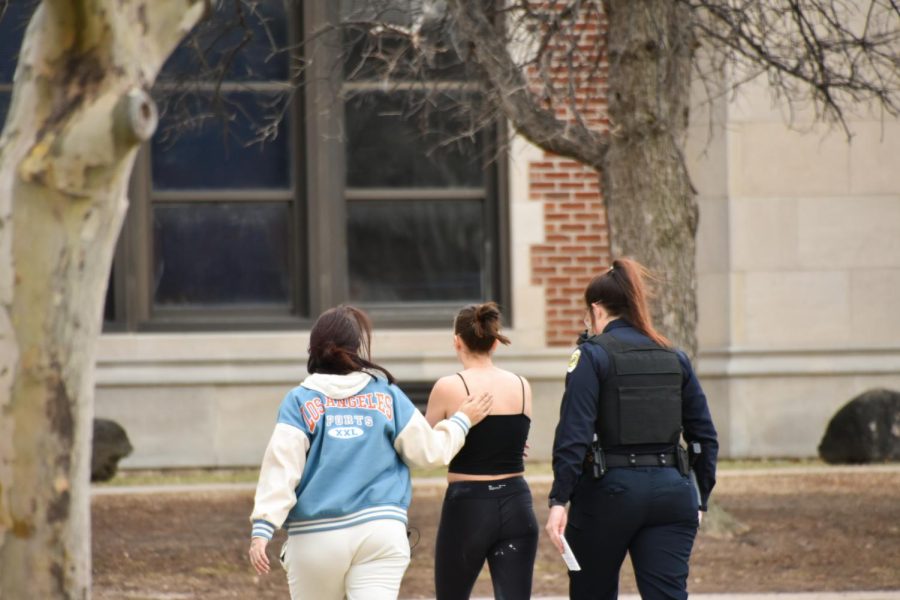 A Wichita East High School student walks back into school after confronting Free the States members about their anti-abortion protest on March 2.`