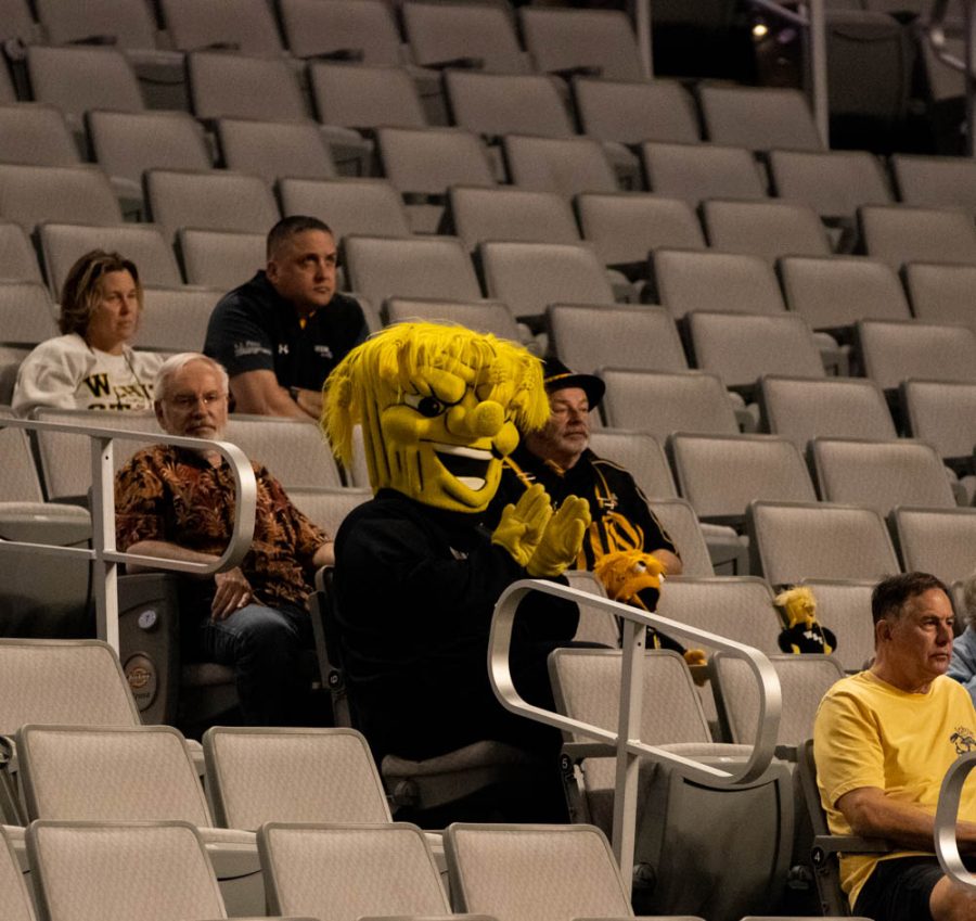 Wu sits with the fans to watch the Shockers while they play South Florida on March 7 in the quarterfinals game of the conference tournament. Director of Athletics Kevin Saal and his wife Jennifer were in attendance.