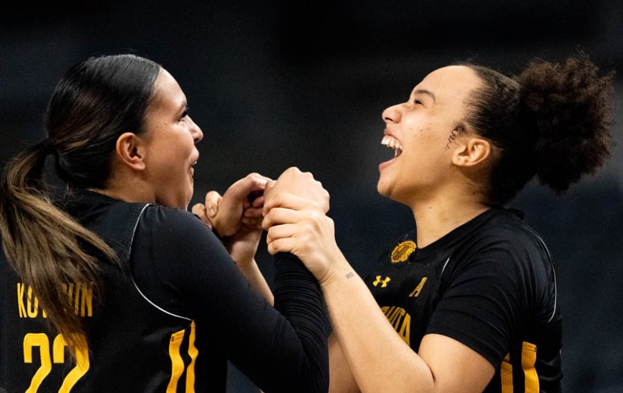 Teammates Ambah Kowcun and Daniela Abies celebrate their win against South Florida after the  quarterfinals game at the AAC tournament in Fort Worth. The Shockers won 65-53 and will play in the semifinals against Houston on March 8. 