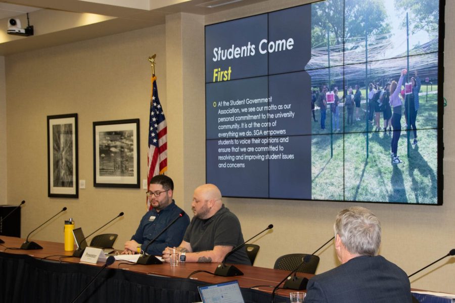Gabriel Fonseca, SGA Advisor, and John Kirk, SGA President, speak at SGAs Student Fees meeting. The organization made a big emphasis on students being their primary focus.