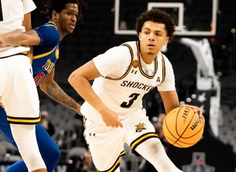 Craig Porter Jr. dribbles the ball in the game against Tulsa in the 2023 AAC tournament.